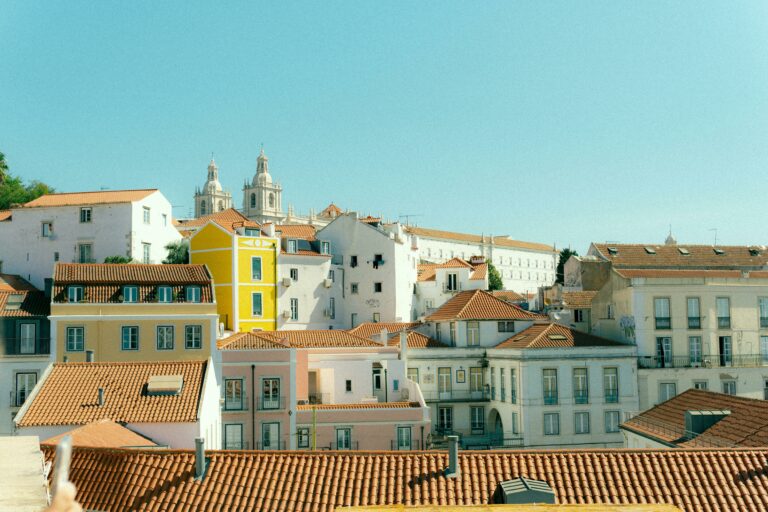 Charming rooftops of Lisbon with a view of historic architecture on a sunny day.